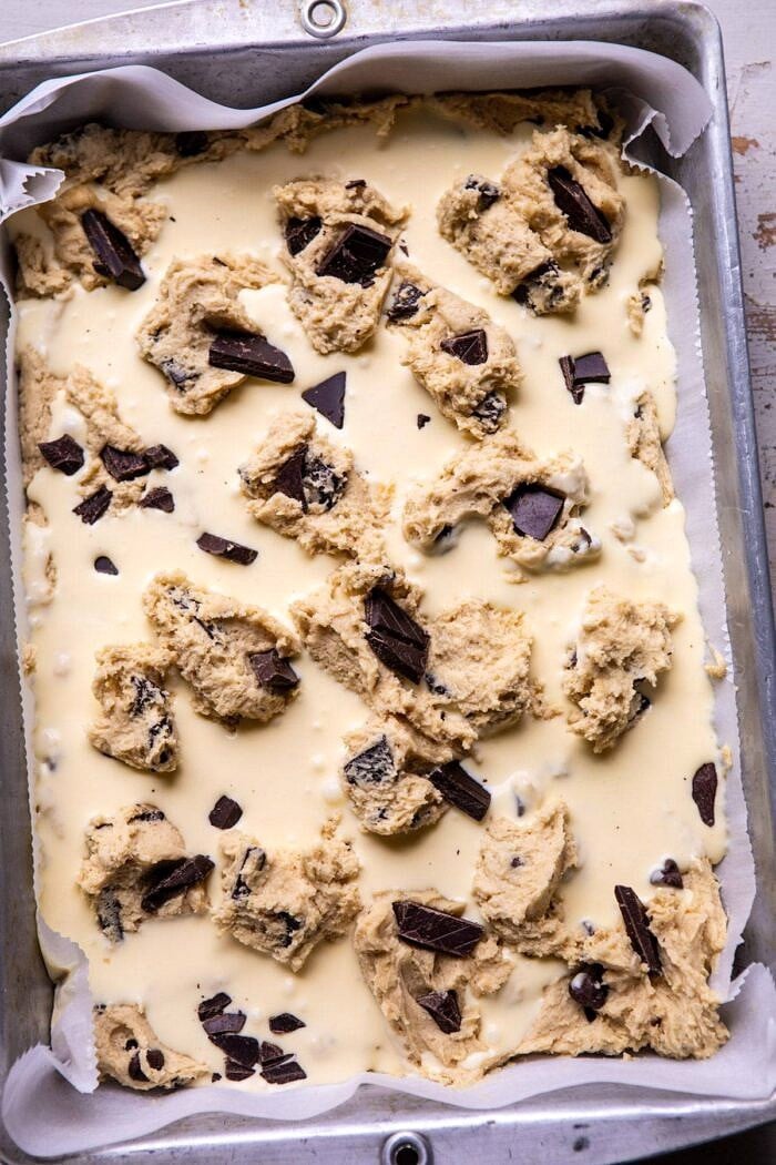 Crème Fraîche Chocolate Chunk Cookie Bars | halfbakedharvest.com #cookies #chocolatechipcookies #cookiebar overhead photo of Crème Fraîche Chocolate Chunk Cookie Bars in baking dish before baking