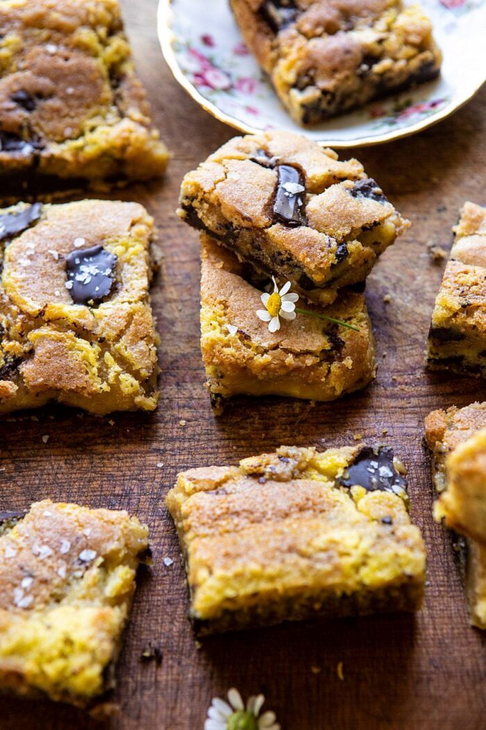 Crème Fraîche Chocolate Chunk Cookie Bars | halfbakedharvest.com #cookies #chocolatechipcookies #cookiebar side agnled close up photo of Crème Fraîche Chocolate Chunk Cookie Bars