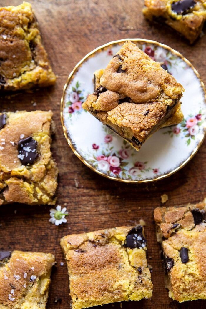 Crème Fraîche Chocolate Chunk Cookie Bars | halfbakedharvest.com #cookies #chocolatechipcookies #cookiebar overhead close up photo of Crème Fraîche Chocolate Chunk Cookie Bar on plate