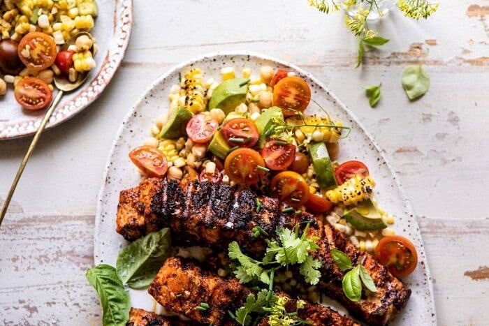 horizontal photo of Lemon Parmesan Salmon with Corn, Tomato, and Avocado Salad