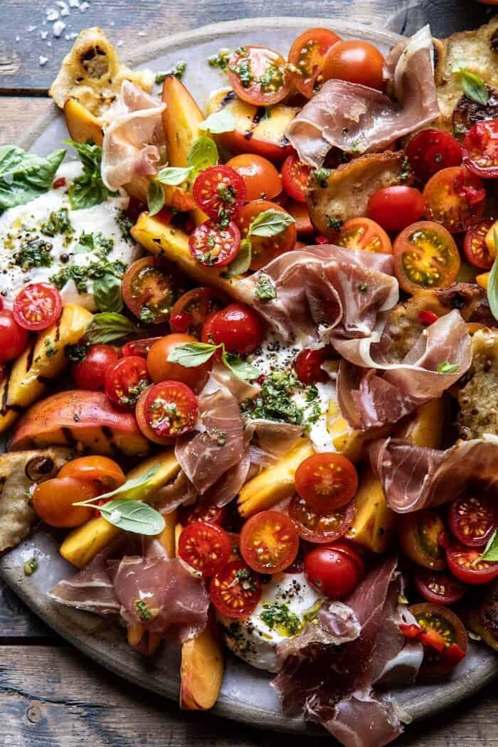 Peach Caprese Salad with Toasted Garlic Naan | halfbakedharvest.com #salad #peaches #burrata overhead close up photo of Peach Caprese Salad with Toasted Garlic Naan