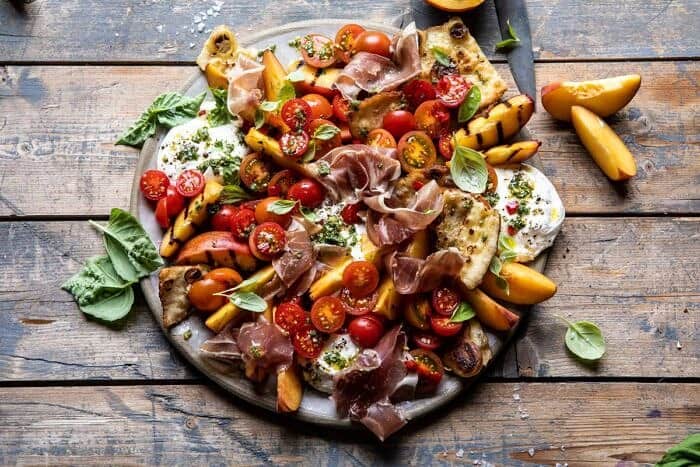 Peach Caprese Salad with Toasted Garlic Naan | halfbakedharvest.com #salad #peaches #burrata horizontal photo of Peach Caprese Salad with Toasted Garlic Naan