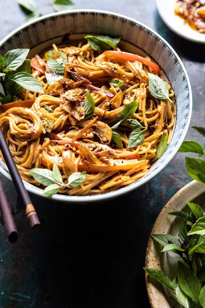 Spicy Peanut Noodles with Chili Garlic Oil | halfbakedharvest.com #peanutnoodles #easyrecipes #dinner #healthy side angled photo of Spicy Peanut Noodles with Chili Garlic Oil