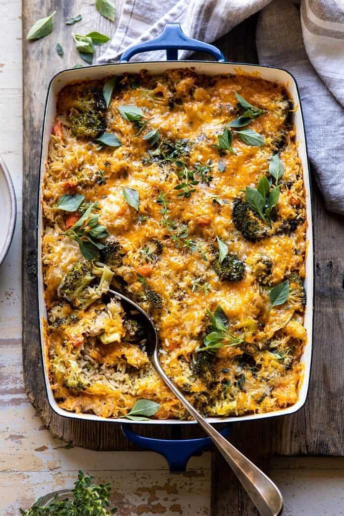 overhead photo of Broccoli Cheddar Chicken and Rice Casserole with spoon in casserole dish