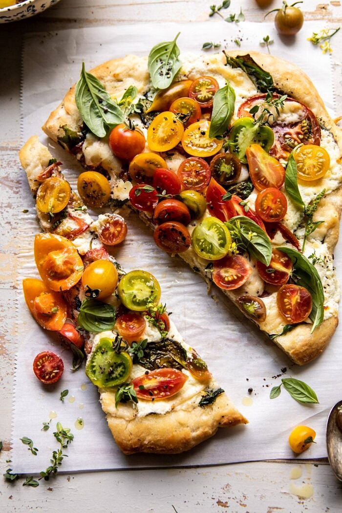 Herbed Butter Heirloom Tomato Pizza | halfbakedharvest.com #pizza #easyrecipe #tomatoes overhead photo of Herbed Butter Heirloom Tomato Pizza
