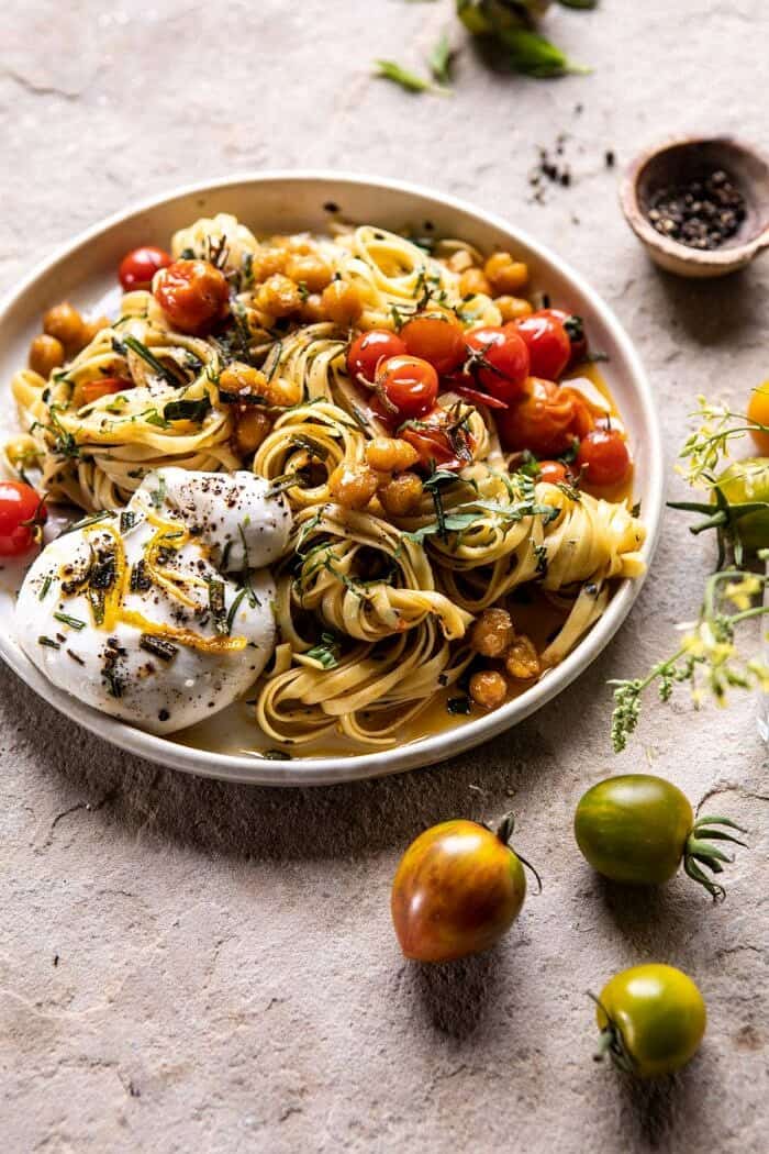 Jammy Cherry Tomato Pasta with Crisp Lemon Rosemary Chickpeas | halfbakedharvest.com #pasta #tomatoes #burrata side angled photo of Jammy Cherry Tomato Pasta with Crisp Lemon Rosemary Chickpeas