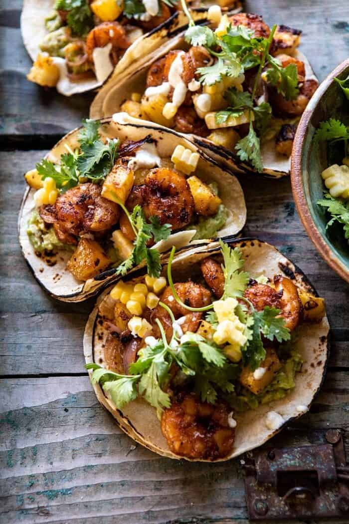 Sheet Pan Hawaiian Pineapple Shrimp Tacos | halfbakedharvest.com #sheetpan #tacos #easyrecipes #seafood side angled close up photo of Sheet Pan Hawaiian Pineapple Shrimp Tacos