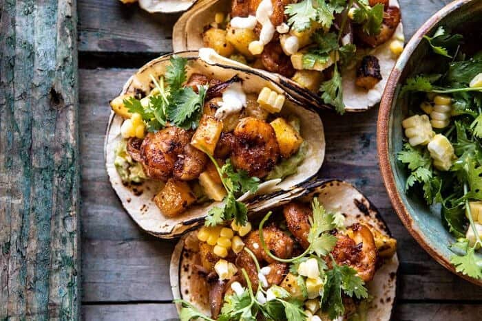 Sheet Pan Hawaiian Pineapple Shrimp Tacos | halfbakedharvest.com #sheetpan #tacos #easyrecipes #seafood overhead horizontal photo of Sheet Pan Hawaiian Pineapple Shrimp Tacos