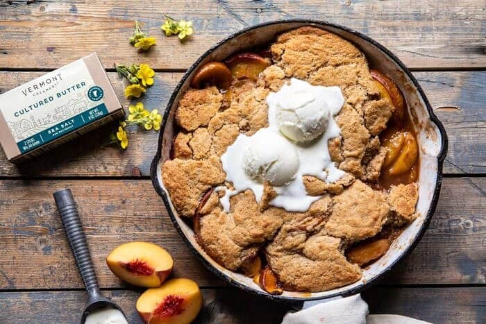 Skillet Brown Sugar Peach Cobbler | halfbakedharvest.com #peach #summer #easyrecipes #cobbler horizontal photo of Skillet Brown Sugar Peach Cobbler | halfbakedharvest.com #peach #summer #easyrecipes #cobbler
