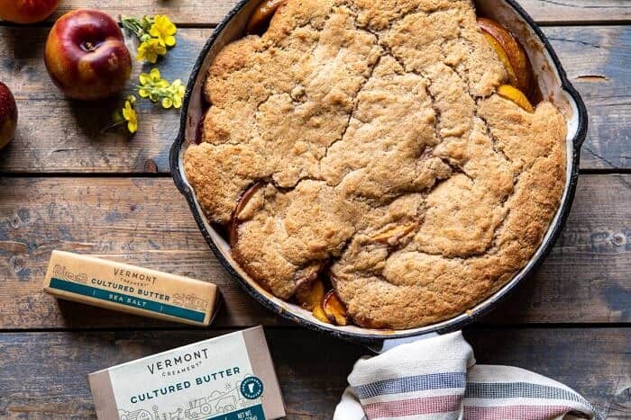 Skillet Brown Sugar Peach Cobbler | halfbakedharvest.com #peach #summer #easyrecipes #cobbler horizontal photo of Skillet Brown Sugar Peach Cobbler