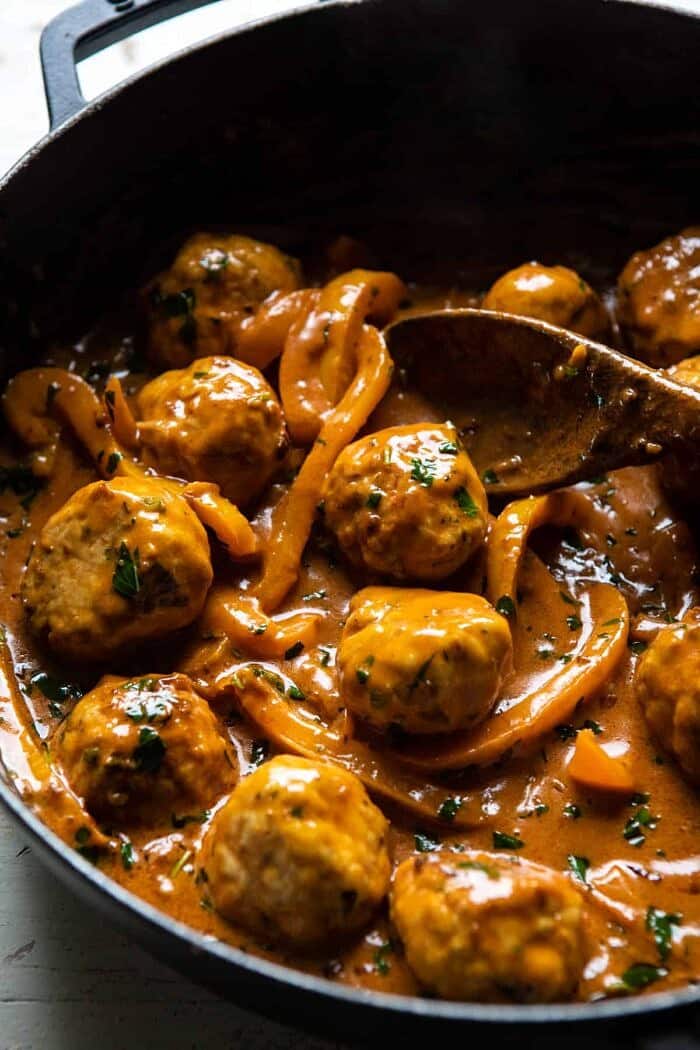 Weeknight 30 Minute Coconut Curry Chicken Meatballs | halfbakedharvest.com #curry #meatballs #healthy side angled photo of Weeknight 30 Minute Coconut Curry Chicken Meatballs in skillet