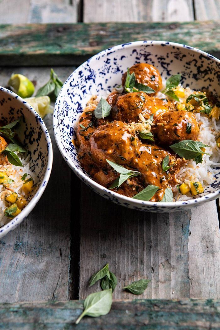 Weeknight 30 Minute Coconut Curry Chicken Meatballs | halfbakedharvest.com #curry #meatballs #healthy side angled photo of Weeknight 30 Minute Coconut Curry Chicken Meatballs in bowls with rice