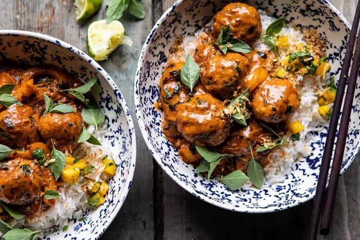 Weeknight 30 Minute Coconut Curry Chicken Meatballs | halfbakedharvest.com #curry #meatballs #healthy horizontal overhead photo of Weeknight 30 Minute Coconut Curry Chicken Meatballs in bowl with rice