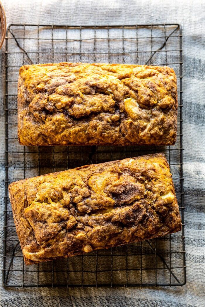 Cream Cheese Swirled Pumpkin Bread with Salted Maple Butter | halfbakedharvest.com #easyrecipes #pumpkinbread #pumpkin #fallrecipes overhead photo of Cream Cheese Swirled Pumpkin Bread on cooling rack after baking