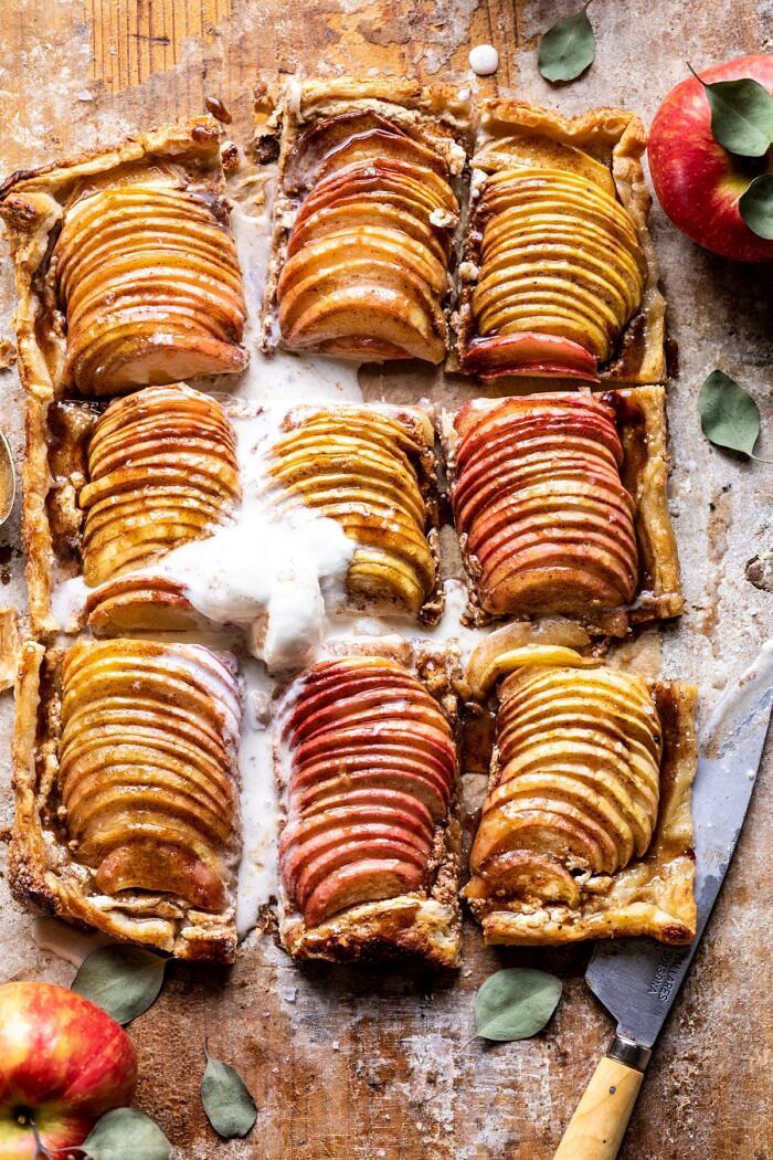 Chai Spiced Apple Ricotta Galette | halfbakedhavest.com #apple #pastry #fallrecipes #autumn overhead photo of Chai Spiced Apple Ricotta Galette with 6 slices cut and ice cream on top of galette