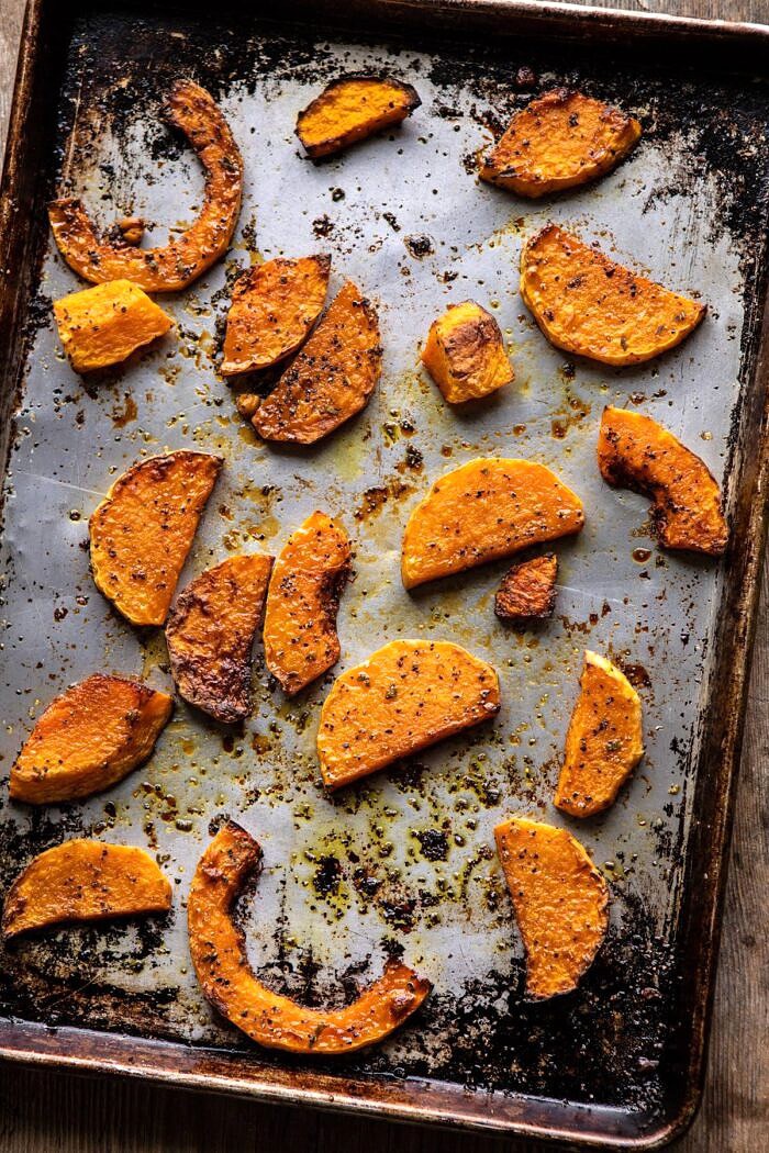 Fall Harvest Roasted Butternut Squash and Pomegranate Salad | halfbakedharvest.com #salad #autumnrecipes #easyrecipes #healthy #butternutsquash overhead photo of Roasted Butternut Squash on baking sheet
