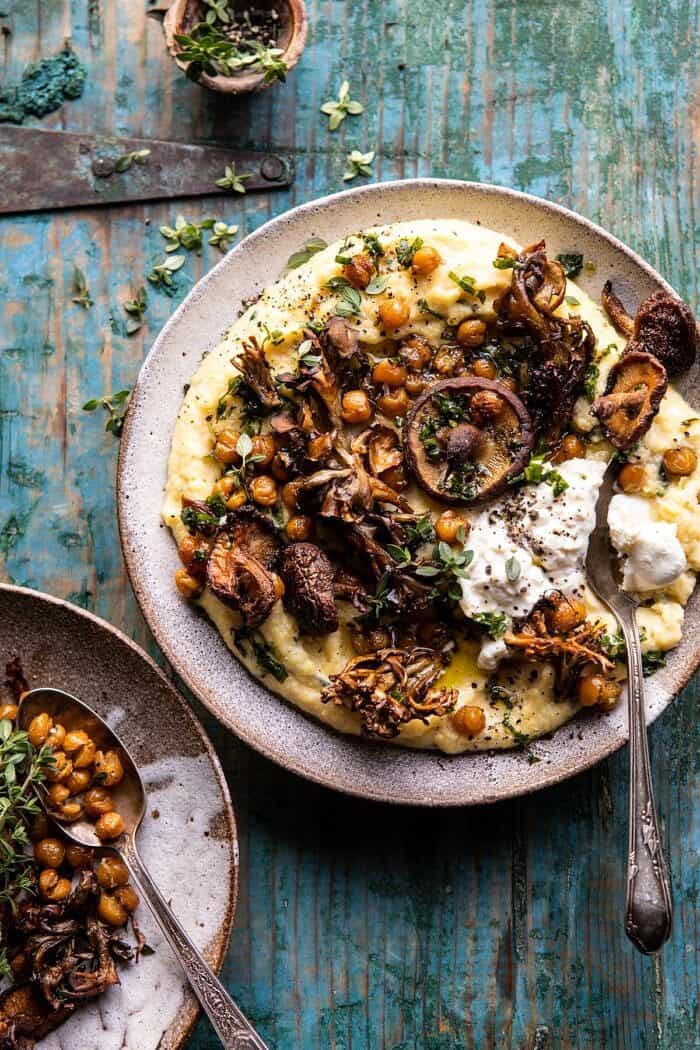 Pesto Polenta with Thyme Roasted Mushrooms and Chickpeas | halfbakedharvest.com #pesto #polenta #mushrooms #easyrecipes overhead photo of Pesto Polenta with Thyme Roasted Mushrooms and Chickpeas with spoon in bowl and 2 bowls in photo