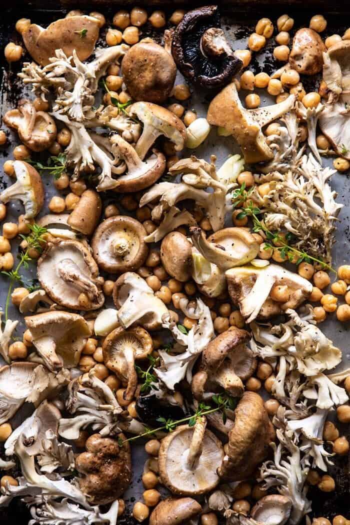 Pesto Polenta with Thyme Roasted Mushrooms and Chickpeas | halfbakedharvest.com #pesto #polenta #mushrooms #easyrecipes overhead photo of Mushrooms and Chickpea on baking sheet before roasting