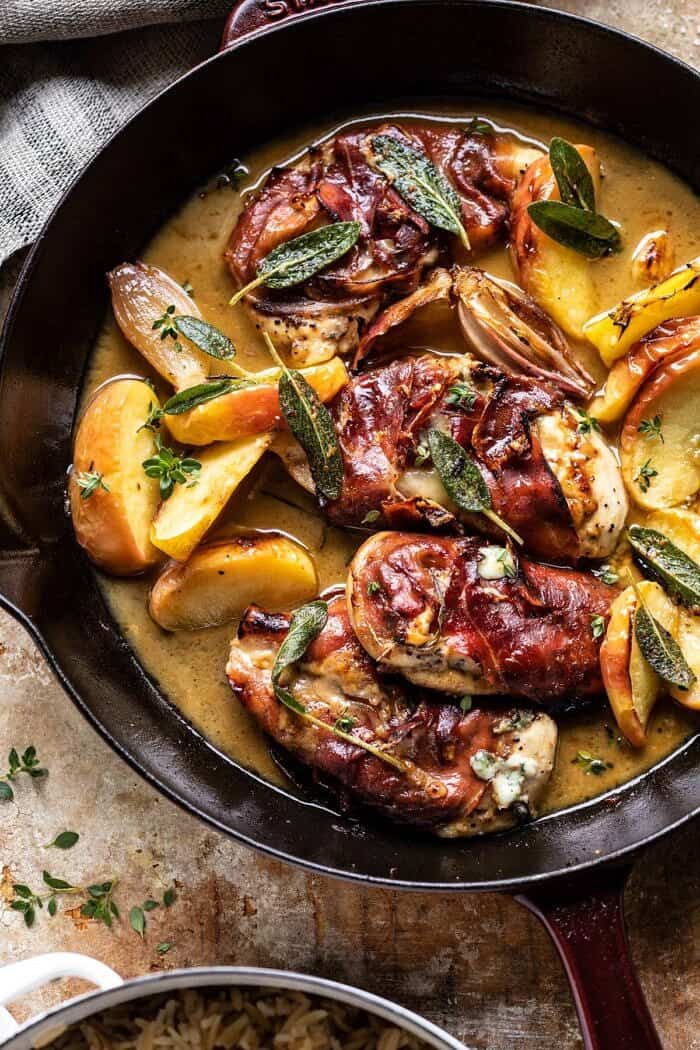 Prosciutto Apple and Sage Butter Chicken with Cider Pan Sauce | halfbakedharvest.com #chicken #apples #fallrecipes #skillet overhead close up photo of Prosciutto Apple and Sage Butter Chicken with Cider Pan Sauce in skillet