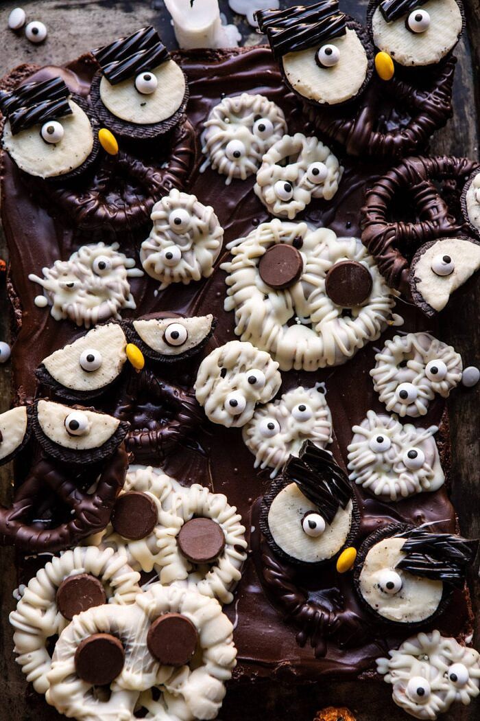 BOO! Spooky Monster Chocolate Covered Pretzel Brownies | halfbakedharvest.com #halloween #brownies #easyrecipes #dessert #fall overhead close up photo of BOO! Spooky Monster Chocolate Covered Pretzel Brownies