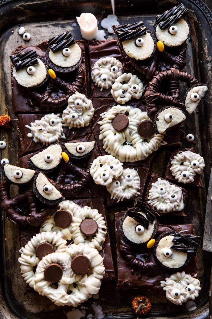 BOO! Spooky Monster Chocolate Covered Pretzel Brownies | halfbakedharvest.com #halloween #brownies #easyrecipes #dessert #fall overhead photo of BOO! Spooky Monster Chocolate Covered Pretzel Brownies after being cut into bars
