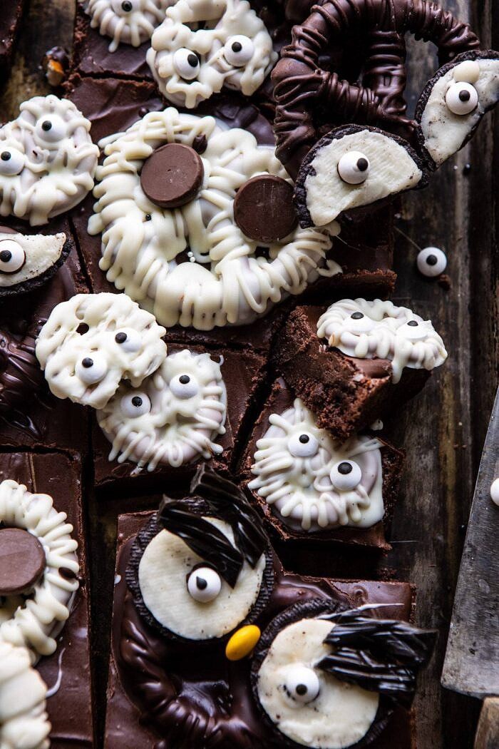 BOO! Spooky Monster Chocolate Covered Pretzel Brownies | halfbakedharvest.com #halloween #brownies #easyrecipes #dessert #fall close up photo of BOO! Spooky Monster Chocolate Covered Pretzel Brownie