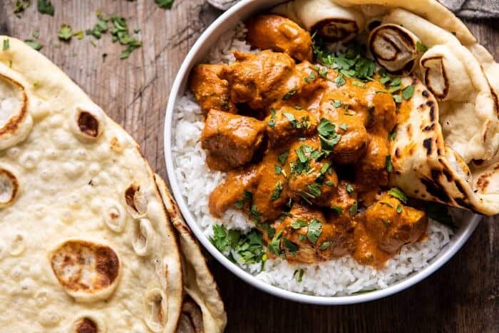 Super Simple Coconut Chicken Tikka Masala | halfbakedharvest.com #Indian #healthyrecipes #chicken #easy #fast overhead photo of Super Simple Coconut Chicken Tikka Masala in bowl with rice