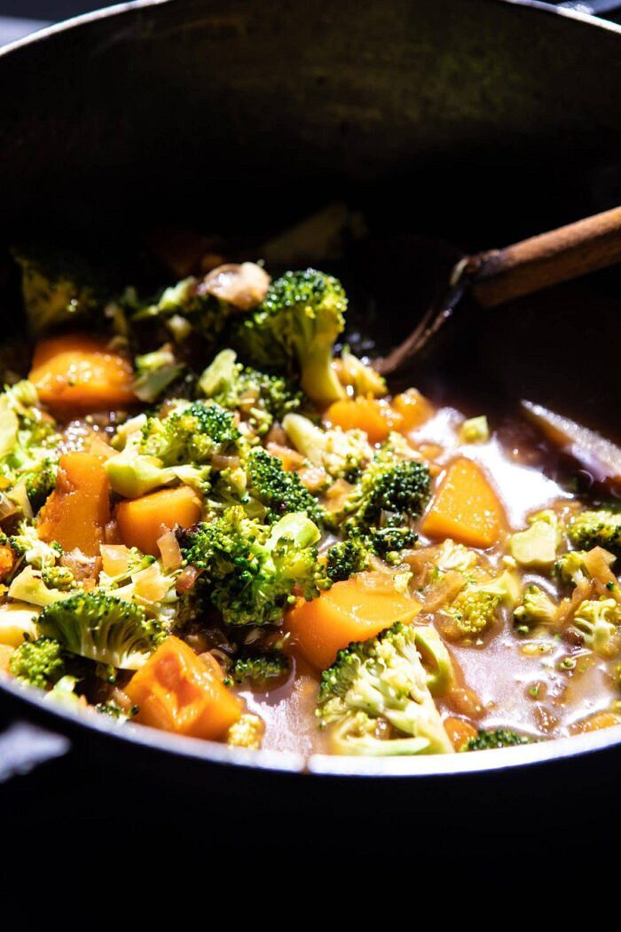 Creamy Broccoli and Butternut Squash Soup with Cheddar Brie Pastries | halfbakedharvest.com #soup #butternutsquash #cheese #fallrecipes side angled photo of Creamy Broccoli and Butternut Squash Soup in soup pot before pureeing