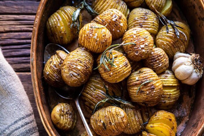 Crispy Rosemary Butter Roasted Potatoes | halfbakedharvest.com #potatoes #fall #autumn #Thanksgiving #Christmas horizontal photo of Crispy Rosemary Butter Roasted Potatoes
