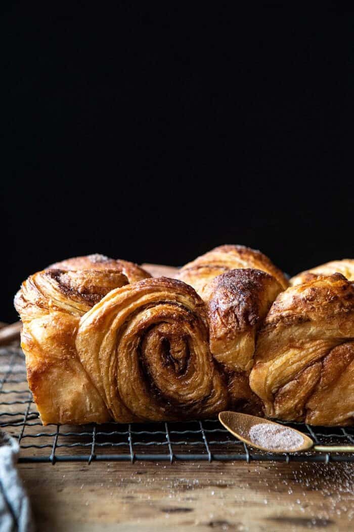 Easy Swirled Cinnamon Sugar Croissant Loaf | halfbakedharvest.com #cinnamon #fall #bread #croissants side angled close up photo of Easy Swirled Cinnamon Sugar Croissant Loaf