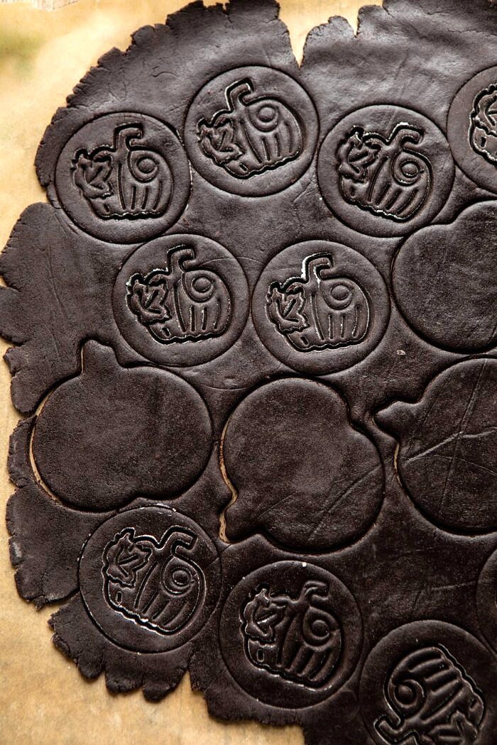 Peanut Butter Stuffed Chocolate Jack-O’-Lantern Cookies | halfbakedharvest.com #peanutbbutter #chocolate #cookies #halloween #thanksgiving overhead photo of Chocolate Jack-O’-Lantern Cookies before baking