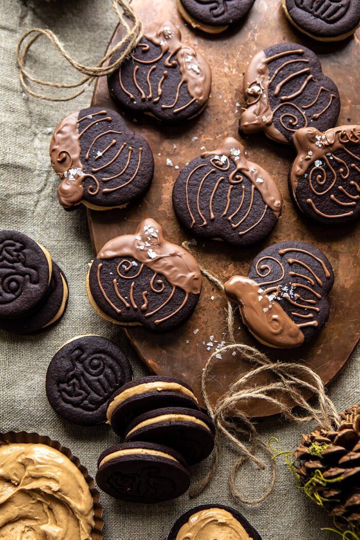 Peanut Butter Stuffed Chocolate Jack-O’-Lantern Cookies | halfbakedharvest.com #peanutbbutter #chocolate #cookies #halloween #thanksgiving overhead photo of Peanut Butter Stuffed Chocolate Jack-O’-Lantern Cookies on serving trey