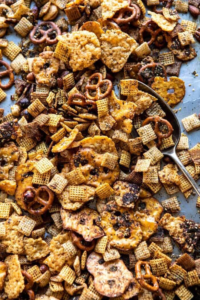Spicy Ranch Chex Mix | halfbakedharvest.com #appetizers #snacks #easyrecipes #gameday #christmas #thanksgiving overhead photo of Spicy Ranch Chex Mix on baking sheet