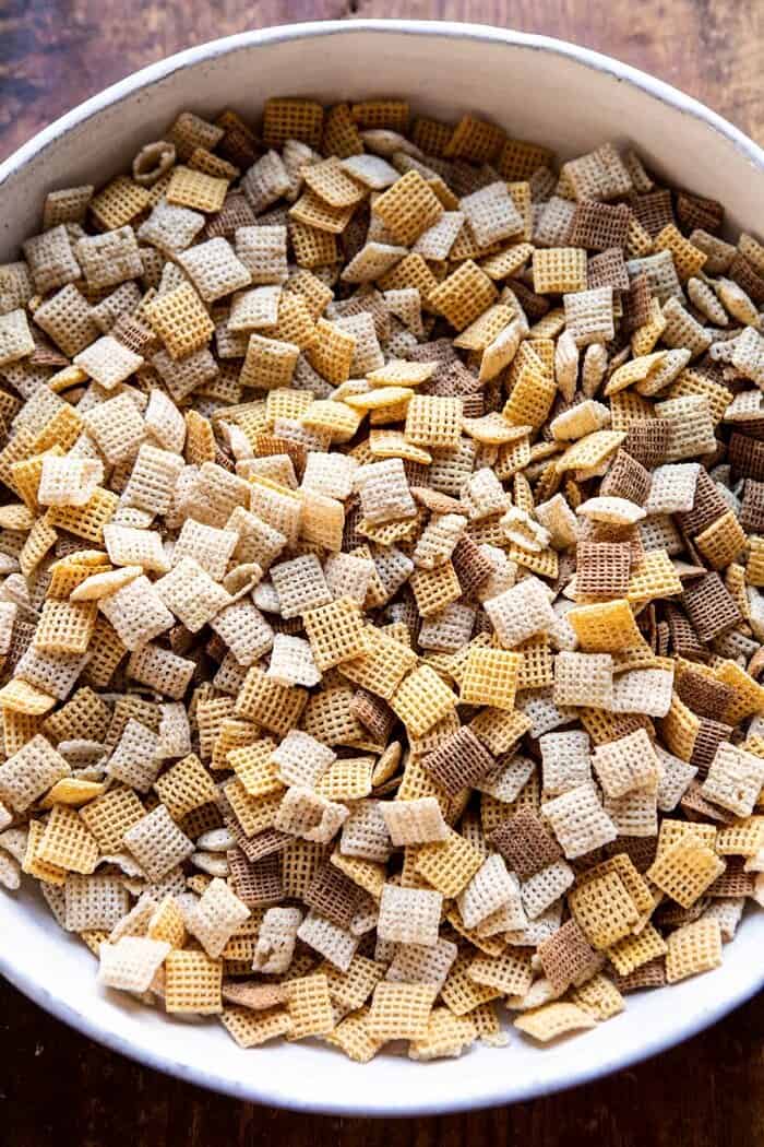 Spicy Ranch Chex Mix | halfbakedharvest.com #appetizers #snacks #easyrecipes #gameday #christmas #thanksgiving overhead photo of Chex cereal in bowl