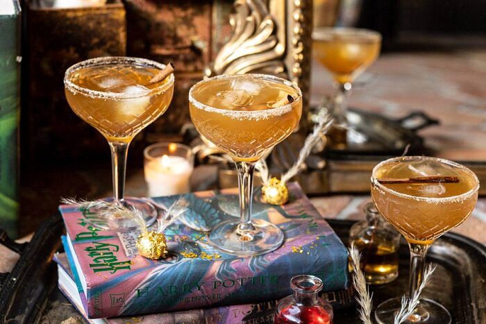 The Golden Snitch Cocktail | halfbakedharvest.com #harrypotter #cocktails #easy #fall horizontal photo of The Golden Snitch Cocktail