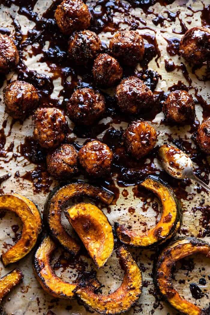 overhead photo of Weeknight Sticky Ginger Sesame Chicken Meatballs on baking sheet with squash 
