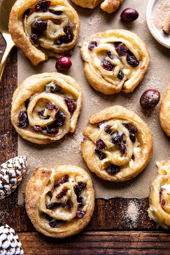 5 Ingredient Cranberry Brie Cinnamon Puff Pastry Swirls | halfbakedharvest.com #brie #cranberries #thanksgiving #christmas overhead photo of 5 Ingredient Cranberry Brie Cinnamon Puff Pastry Swirls