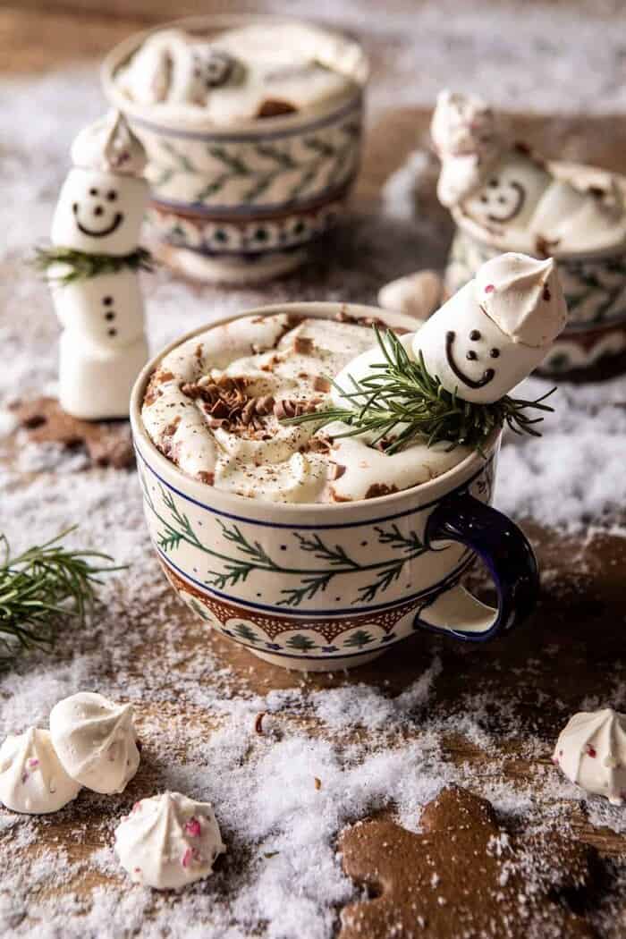 Creamy Coconut Hot Chocolate | halfbakedharvest.com #hotchocolate #easyrecipe #christmas #dessert front on photo of Creamy Coconut Hot Chocolate with melting snowman in mug
