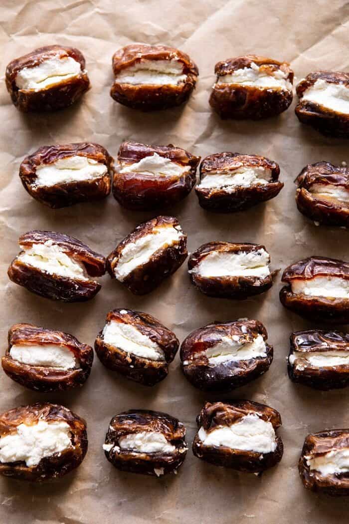 Goat Cheese Stuffed Bacon Wrapped Dates with Rosemary Honey | halfbakedharvest.com #dates #goatcheese #thanksgiving #appetizer overhead photo Goat Cheese Stuffed in dates before baking