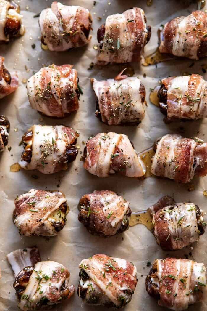 Goat Cheese Stuffed Bacon Wrapped Dates with Rosemary Honey | halfbakedharvest.com #dates #goatcheese #thanksgiving #appetizer overhead photo of Goat Cheese Stuffed Bacon Wrapped Dates before baking