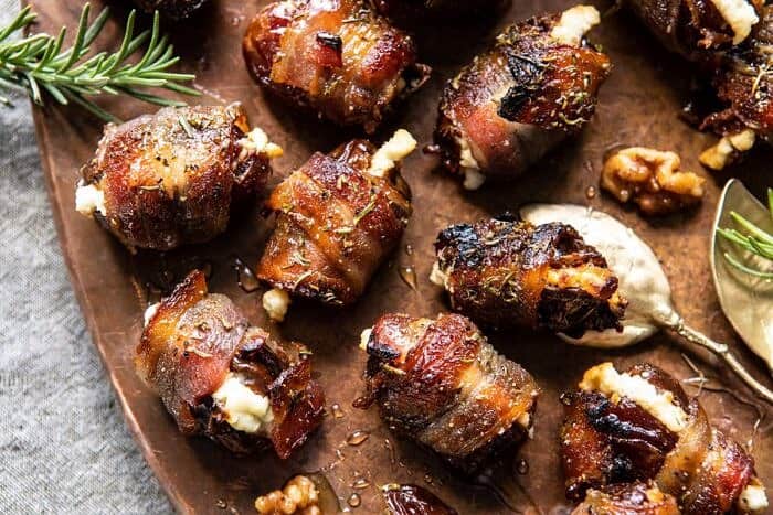 Goat Cheese Stuffed Bacon Wrapped Dates with Rosemary Honey | halfbakedharvest.com #dates #goatcheese #thanksgiving #appetizer horizontal photo of Goat Cheese Stuffed Bacon Wrapped Dates with Rosemary Honey
