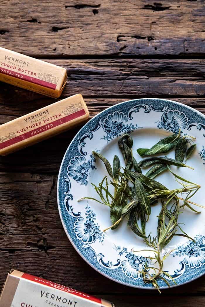 Roasted Butternut Squash and Spinach Lasagna | halfbakedharvest.com #lasagna #holiday #thanksgiving overhead photo of herbs and butter