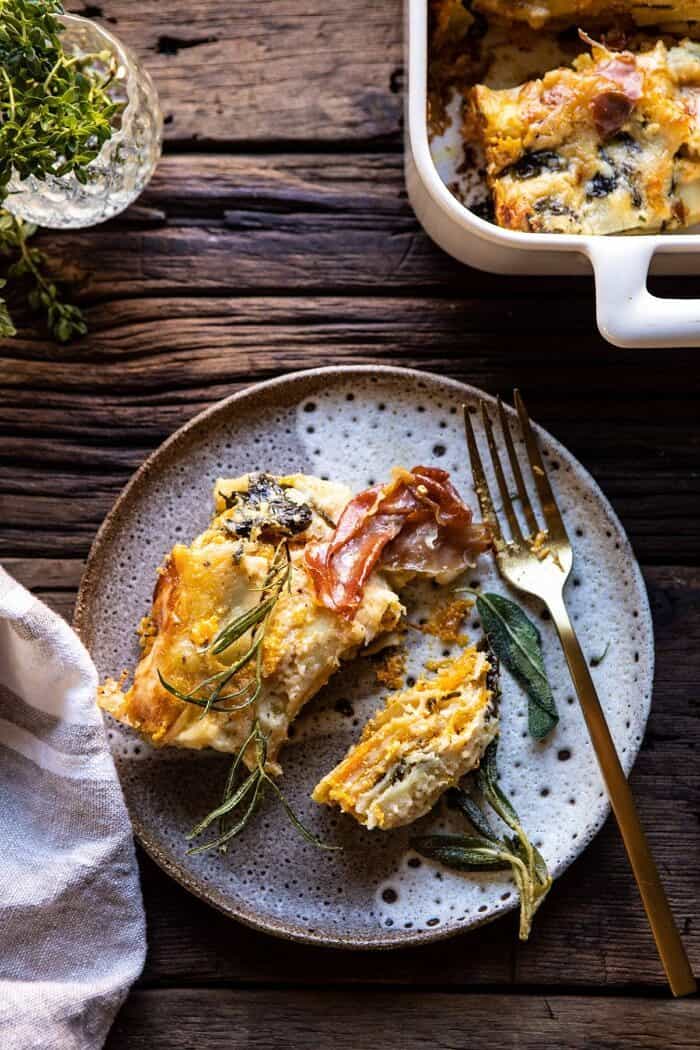 Roasted Butternut Squash and Spinach Lasagna | halfbakedharvest.com #lasagna #holiday #thanksgiving overhead photo of Roasted Butternut Squash and Spinach Lasagna slice on serving plate with fork
