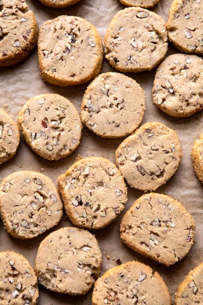 Slice n Bake Salted Chocolate Butter Pecan Cookies | halfbakedharvest.com #cookies #christmas #thanksgiving #chocolate overhead photo of Slice n Bake Salted Chocolate Butter Pecan Cookies after baking on cookie sheet