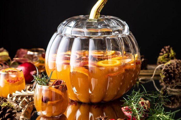 Thanksgiving Sangria | halfbakedharvest.com #thanksgiving #sangria #holiday horizontal photo of Thanksgiving Sangria with pitcher in background