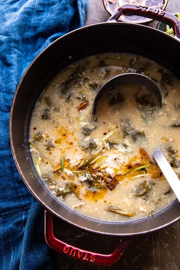 30 Minute Chinese Egg Drop Chicken Rice Soup with Garlicky Chile Oil | halfbakedharvest.com #chinese #easyrecipes #30minutedinner #soup overhead photo 30 Minute Chinese Egg Drop Chicken Rice Soup in soup pot with ladle in soup