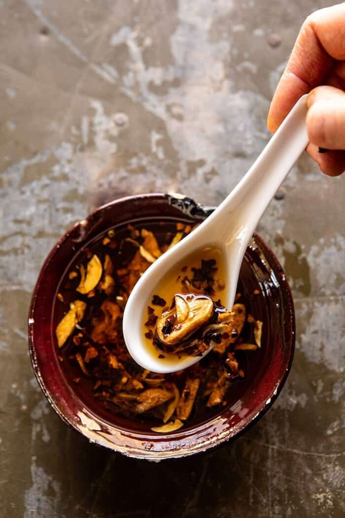 30 Minute Chinese Egg Drop Chicken Rice Soup with Garlicky Chile Oil | halfbakedharvest.com #chinese #easyrecipes #30minutedinner #soup over head photo of Garlicky Chile Oil