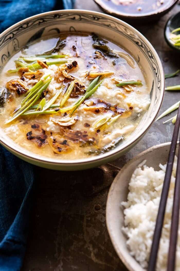 30 Minute Chinese Egg Drop Chicken Rice Soup with Garlicky Chile Oil | halfbakedharvest.com #chinese #easyrecipes #30minutedinner #soup side angle photo of 30 Minute Chinese Egg Drop Chicken Rice Soup with Garlicky Chile Oil