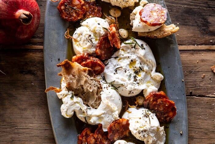 Burrata with Lemon Pepper Salami Bites | halfbakedharvest.com #burrata #appetizer #christmas horizontal photo of Burrata with Lemon Pepper Salami Bites