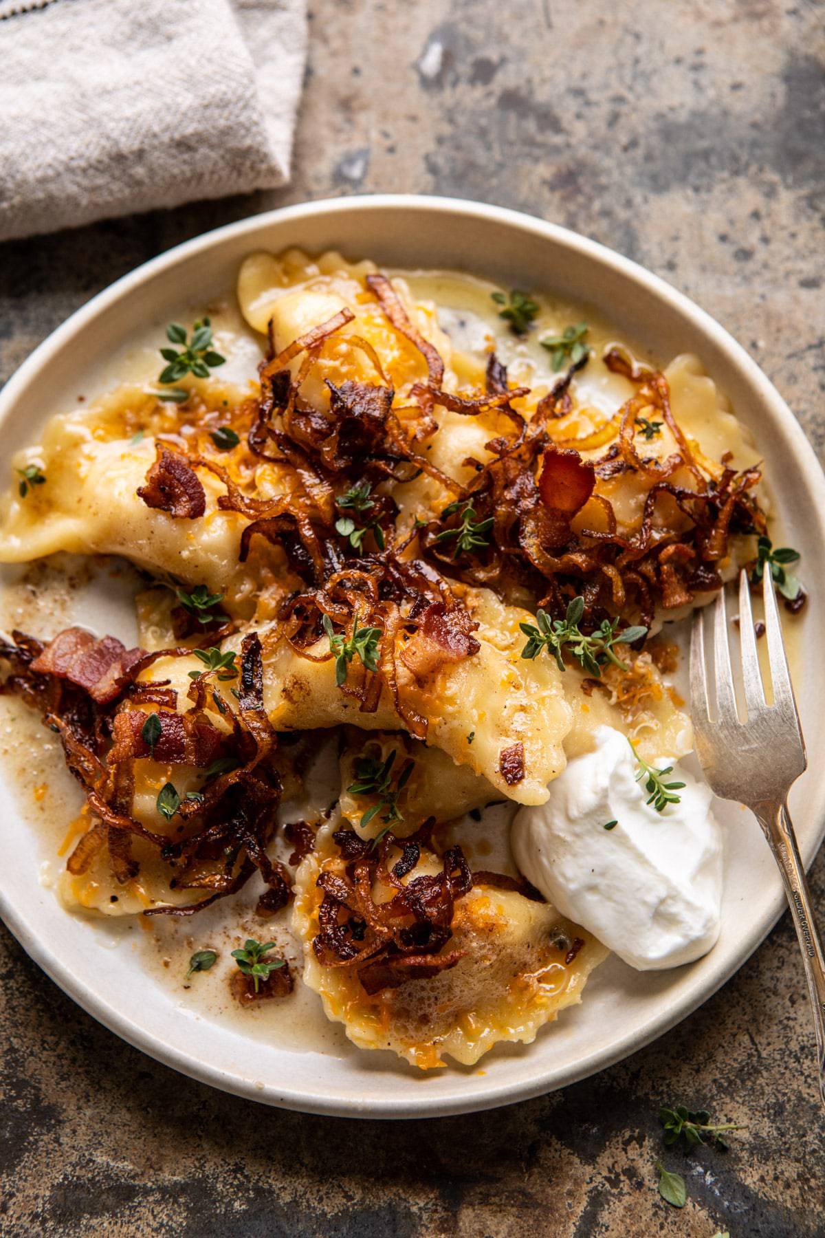 Cheddar Pierogi with Caramelized Onions and Bacon | halfbakedharvest.com #pierogi #homemade #Christmas